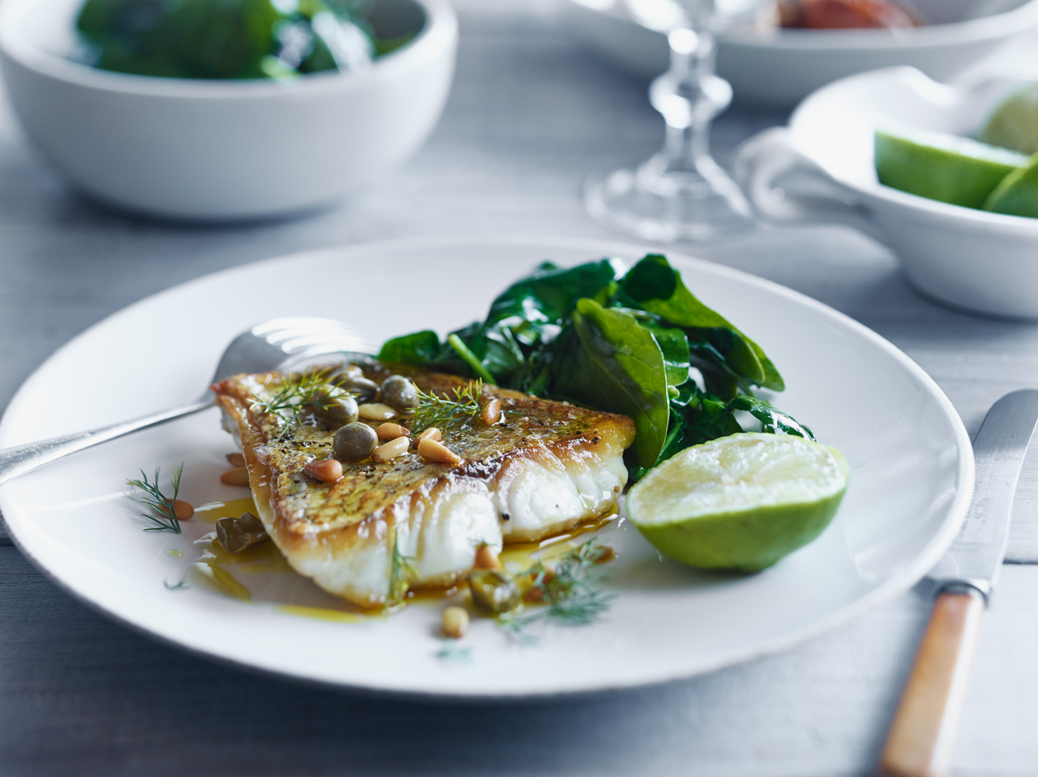 Perfectly cooked crispy skin fish served with capers, pine nuts and spinach, finished with a drizzle for precision of Extra Virgin Olive Oil.