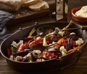 Oven-roasted vegetables tossed with EVO (Extra Virgin Olive Oil) and garlic, topped with fetta for Mediterranean olive oil flavours.